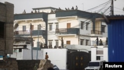 Somali security forces secure the scene of a militant attack at a building in Abdias district of Mogadishu, Somalia, Feb. 21, 2023.