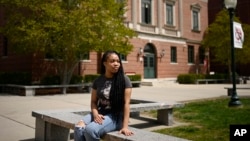 Ashnaelle Bijoux poses on campus at Norwich Free Academy in Norwich, Connecticut, April 27, 2024. Bijoux, a senior at NFA, has been unable to complete the FAFSA form due to a glitch with the form.
