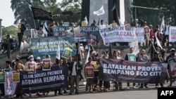 Members of the Muslim community protest against a government plan to develop the Rempang Island into a Chinese-funded economic zone that would displace around 7,500 people, near the Presidential Palace in Bogor, Indonesia, on Sept. 24, 2023.
