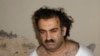 Khalid Sheikh Mohammed, terduga dalang di balik serangan 11 September 2001, terlihat dalam foto penangkapannya pada 1 Maret 2003. (Foto: AP)