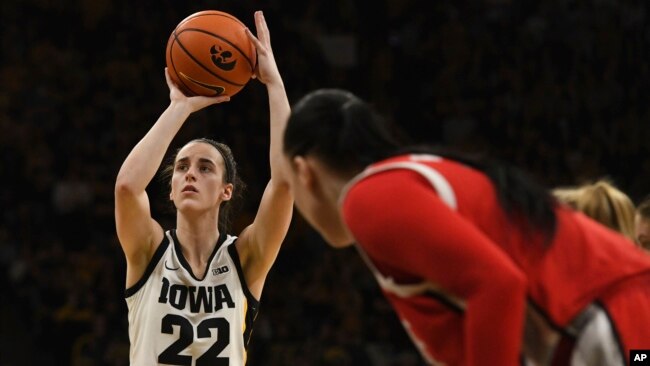 Iowa guard Caitlin Clark (22) takes a free throw against Ohio State during the second half of an NCAA college basketball game, in Iowa City, Iowa, March 3, 2024.