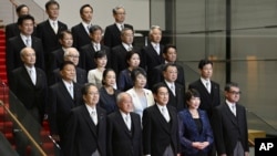 Japanese Prime Minister Fumio Kishida poses with his new Cabinet members in Tokyo, Sept. 13, 2023. Kishida is shuffling his Cabinet and key party posts in an apparent move to strengthen his position before a key party leadership vote next year,