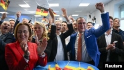 Alternative for Germany (AfD) party co-leaders Alice Weidel and Tino Chrupalla react to results after the polls closed in the European Parliament elections, in Berlin, June 9, 2024.