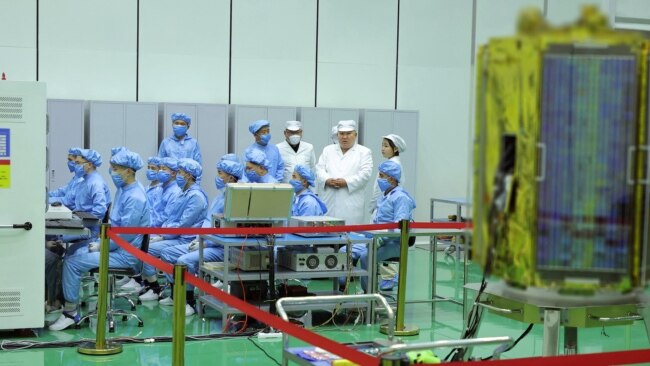 FILE - North Korean leader Kim Jong Un and his daughter Kim Ju Ae inspect the country's first military reconnaissance satellite, in Pyongyang, North Korea, May 16, 2023, in this image released by North Korea's Korean Central News Agency on May 17, 2023.