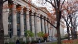 FILE - Students walk through the Harvard Law School area on the campus of Harvard University in Cambridge, Mass., on Nov. 19, 2002. 