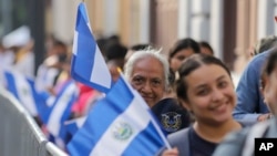 Supporters of El Salvador's President Nayib Bukele line up outside of the National Palace prior to his inauguration for a second term in San Salvador, El Salvador, June 1, 2024.