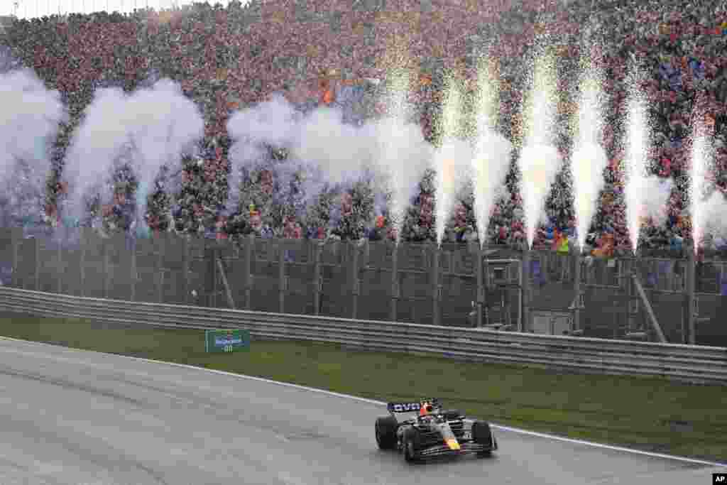 Red Bull driver Max Verstappen of the Netherlands celebrates after winning during the Formula One Dutch Grand Prix at the Zandvoort racetrack, in Zandvoort, Netherlands.