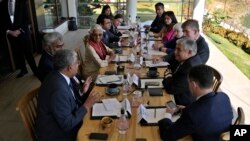U.S. Treasury Secretary Janet Yellen, right center in blue jacket, listens to Nandan Nilekani, left, of Infosys during a meeting with Indian and U.S. technology business leaders on the sidelines of G-20 financial conclave in India, Feb. 25, 2023.