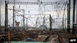 This photograph shows war-damaged railroad tracks and power lines in the Sosnove village, Donetsk region, on March 1, 2023.