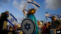 Israelis protest against plans by Prime Minister Benjamin Netanyahu's government to overhaul the judicial system in Tel Aviv, Israel, Sept. 9, 2023. 