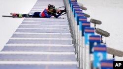 FILE — Joanne Reid competes during the women's 4 x 6km relay race at the biathlon World Cup in Anterselva, Italy, Jan. 22, 2022. The U.S. Biathlon national champion was sexually harassed and abused for years while racing on the sport's World Cup circuit, investigators found. 