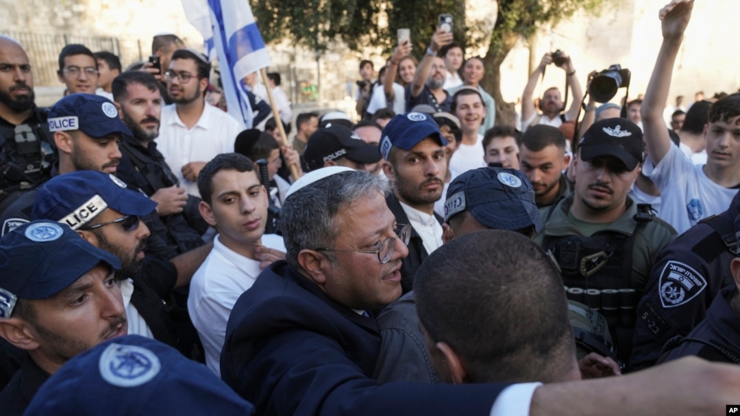 FILE - Israel's National Security Minister Itamar Ben-Gvir, center, attends a march marking Jerusalem Day, in front of the Damascus Gate of Jerusalem's Old City, May 18, 2023. 