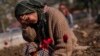 FILE - A member of the Vehibe family who lost a relative during the recent earthquakes mourns during the victim's burial in Antakya, southeastern Turkey, Feb. 11, 2023.