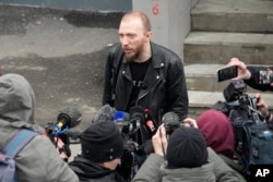 Daniil Berman, the lawyer of arrested Wall Street Journal reporter Evan Gershkovich, speaks to journalists near the Lefortovsky court, in Moscow, Russia, Thursday, March 30, 2023. (AP Photo/Alexander Zemlianichenko)