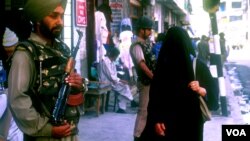 In this undated photo, Indian security personnel guard a marketplace in Srinagar in Indian-administered Kashmir. (Mir Imran for VOA)