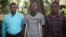 Nan foto sa a ke avoka Ela Matthews pataje ak lapres, David Boniface, Nissage Martyr ak Juders Yseme (de goch a dwat) poze pou yon foto ansanm nan peyi d Ayiti, nan mwad Janvye 2014. 