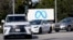 Cars drive past a Meta sign outside of the company's headquarters in Menlo Park, Calif., March 7, 2023.