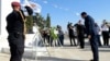 Cypriot President Nikos Christodoulides bows in front of a monument erected in memory of soldiers killed in the 1974 Turkish invasion of Cyprus at the Tymvos Makedonitissas military cemetery in Nicosia, Cyprus, July 20, 2024.