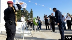 Cypriot President Nikos Christodoulides bows in front of a monument erected in memory of soldiers killed in the 1974 Turkish invasion of Cyprus at the Tymvos Makedonitissas military cemetery in Nicosia, Cyprus, on July 20, 2024.