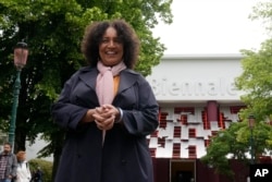 Lesley Lokko, a Scottish-Ghanian who is the first African to curate the architectural Biennale poses for photographers, at the Biennale International Architecture exhibition, in Venice, Italy, May 17, 2023.