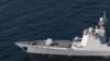 A Chinese warship takes part in a joint naval military drill between Iran, Russia, and China in the Gulf of Oman, Iran, in this picture obtained by Reuters on March 17, 2023. 