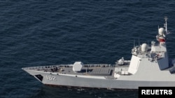 File - A Chinese warship takes part in a joint naval military drill between Iran, Russia, and China in the Gulf of Oman, Iran, in this picture obtained by Reuters on March 17, 2023. 