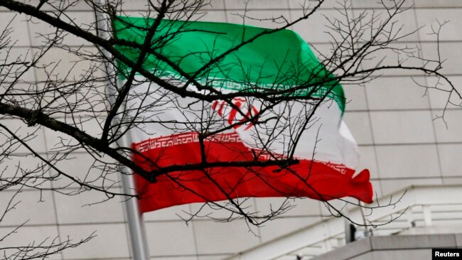 FILE - Iran's national flag is pictured at Iran's embassy to Germany in Berlin Dec. 1, 2011. 