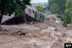 Structures are washed away in Blantyre on March 14, 2023, following Cyclone Freddy's landfall.