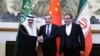 Chinese diplomat Wang Yi, center, poses with Ali Shamkhani, secretary of Iran’s Supreme National Security Council, right, and Musaad bin Mohammed Al Aiban, Saudia Arabia's national security adviser, in Beijing, March 10, 2023. (China Daily via Reuters) 