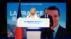French far-right leaders Marine Le Pen, left, and Jordan Bardella address supporters after the polls closed during the European Parliament elections, in Paris, France, June 9, 2024.