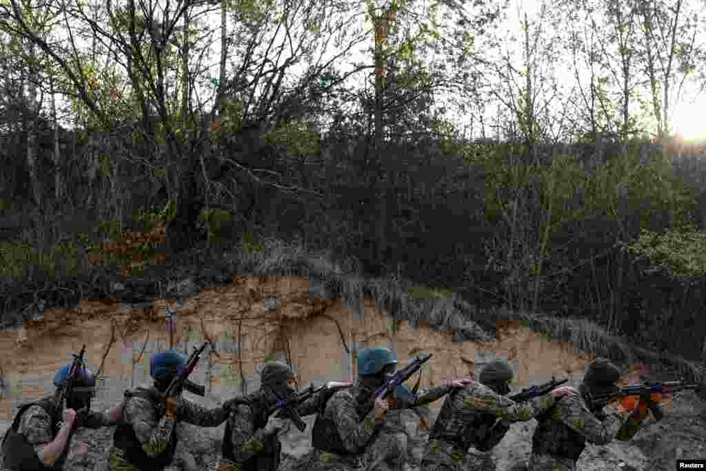 Members of the Siberian Battalion of the Ukraine&#39;s Armed Forces International Legion attend military exercises at an undisclosed location in Kyiv region, Ukraine.