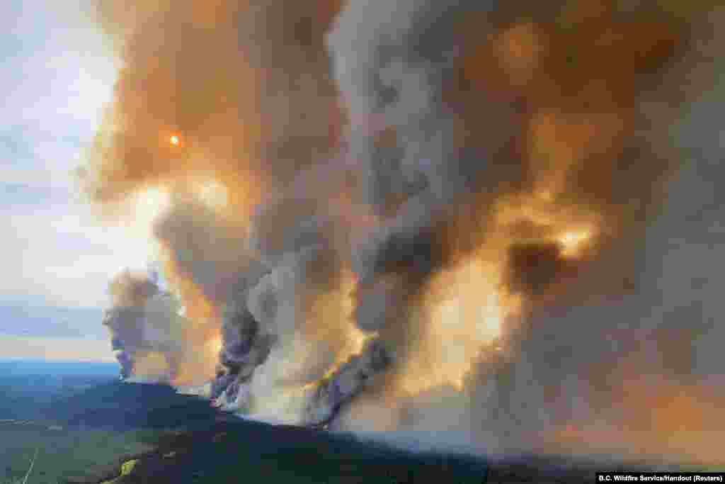 Smoke rises from a wildfire in the Donnie Creek Complex south of Fort Nelson, British Columbia, Canada, May 27, 2023.