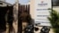 FILE - Police at the gate of an office of Marion Biotech, a healthcare and pharmaceutical company and a part of the Emenox Group, whose cough syrup has been linked to the deaths of children in Uzbekistan, in Noida, India, Dec. 29, 2022. 