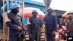 (FILE) United Nations peacekeepers stand in the market in Bouar, Central African Republic, March 8, 2024.