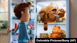 This image released by Sony Pictures shows characters Jon, voiced by Nicholas Hoult, clockwise from left, Vic, voiced by Samuel L. Jackson, and Garfield, voiced by Chris Pratt, in a scene from the animated film "The Garfield Movie." 