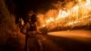 A firefighter works to contain wildfires in Nogales, in Veracruz state, Mexico, March 25, 2024.