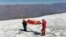 This photo distributed by the Peruvian National Police shows police carrying a body that they identify as U.S. mountain climber William Stampfl, on Huascaran mountain in Huaraz, Peru, July 5, 2024. Stampfl was buried in an avalanche in 2002.