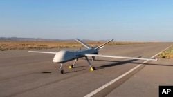 This image released by the official website of Iran's Defense Ministry on Aug. 22, 2023, shows the Mohajer-10 drone at an undisclosed location in Iran.