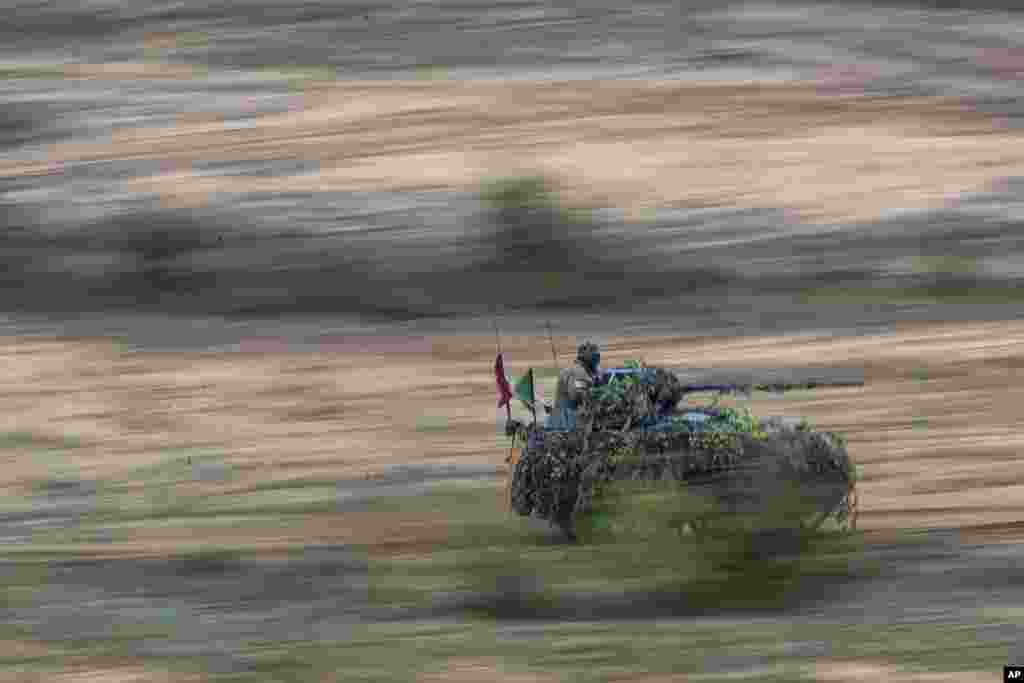 Soldiers take part in the Lithuanian-German military exercise Grand Quadriga, at a training range in Pabrade, north of the capital Vilnius, Lithuania.