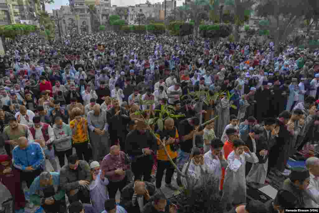 Thousands of worshippers, many of them mired in economic hardship and social inequality, come together for Eid prayers in the outdoor courtyard of the ancient Sultan Hassan Mosque, Old Cairo.