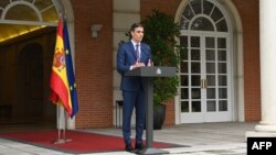 In this handout image made available by La Moncloa on May 29, 2023, Spanish Prime Minister Pedro Sanchez speaks at La Moncloa Palace in Madrid as he called a snap election for July. 