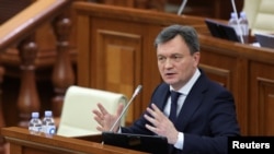 Dorin Recean, Moldovan president's nominee for prime minister, makes an address during a session of parliament in Chisinau, Feb. 16, 2023.