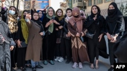 Afghan women stage a protest for their rights to mark International Women's Day, in Kabul, March 8, 2023.