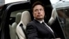 FILE - Tesla Chief Executive Officer Elon Musk, who also owns the X platform, formerly known as Twitter, gets in a Tesla car as he leaves a hotel in Beijing, China, May 31, 2023.