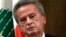 FILE - Riad Salameh, the former governor of Lebanon's central bank, listens during a press conference in Beirut on Nov. 11, 2019. An audit into the central bank obtained on Aug. 11, 2023, revealed yearslong misconduct by Salameh.