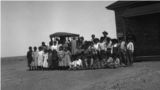 In this 1917 photo, John A. Keirn and Moenkopi Day School students pose beside a rare visiting automobile. Courtesy of USU Special Collections, Merrill-Cazier Library.