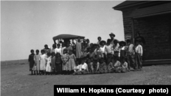 In this 1917 photo, John A. Keirn and Moenkopi Day School students pose beside a rare visiting automobile. Courtesy of USU Special Collections, Merrill-Cazier Library.