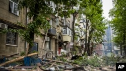 In this photo provided by the Dnipropetrovsk Regional Military Administration, a view of the damage after Russia's attack on residential building in Dnipro, Ukraine, April 19, 2024. 