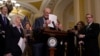 U.S. Senate Majority Leader Chuck Schumer holds up his notes at the beginning of a press conference announcing that he will unveil a new package of legislation to address competition with China on Capitol Hill in Washington, May 3, 2023. 