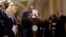 U.S. Senate Majority Leader Chuck Schumer holds up his notes at the beginning of a press conference announcing that he will unveil a new package of legislation to address competition with China on Capitol Hill in Washington, May 3, 2023. 